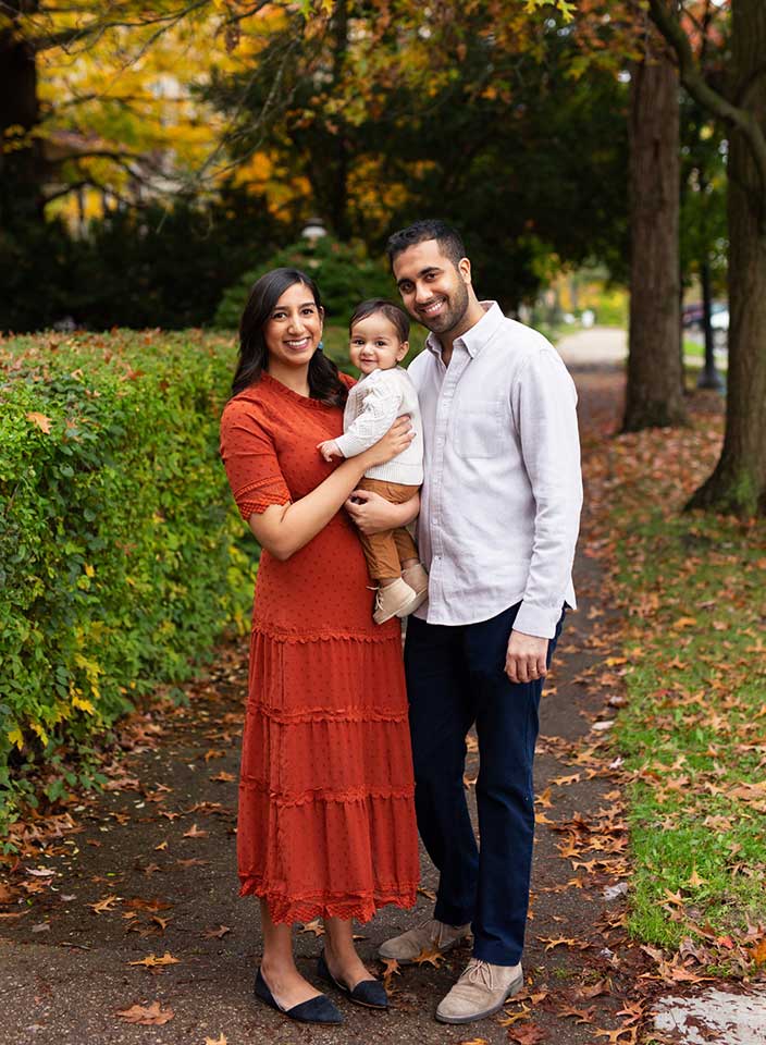 family of 3 posing in Hudson gazebo for family photos