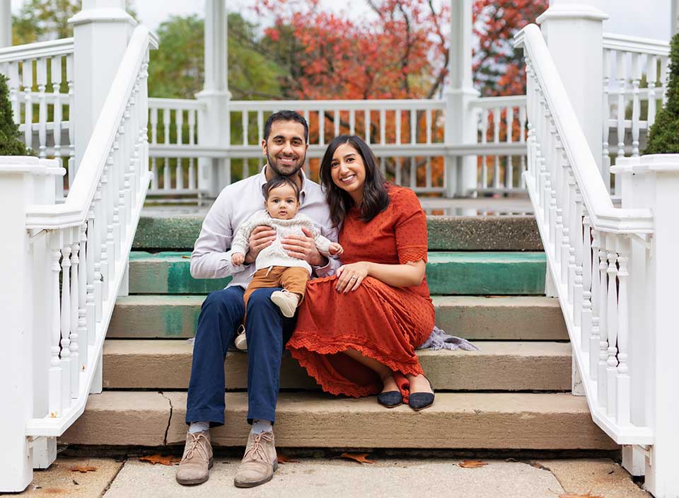 family of 3 posing in Hudson gazebo for family photos