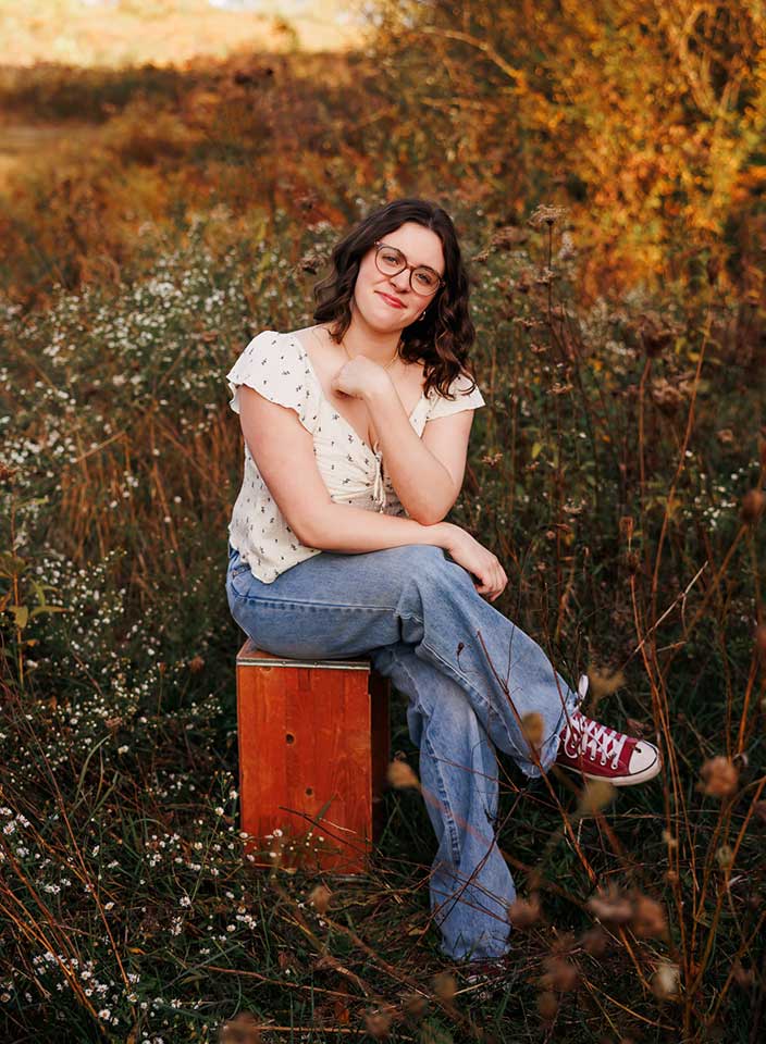 Stow High School senior posing in field