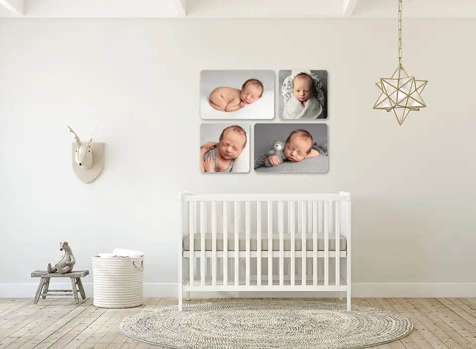 nursery featuring crib and wall art of newborn session