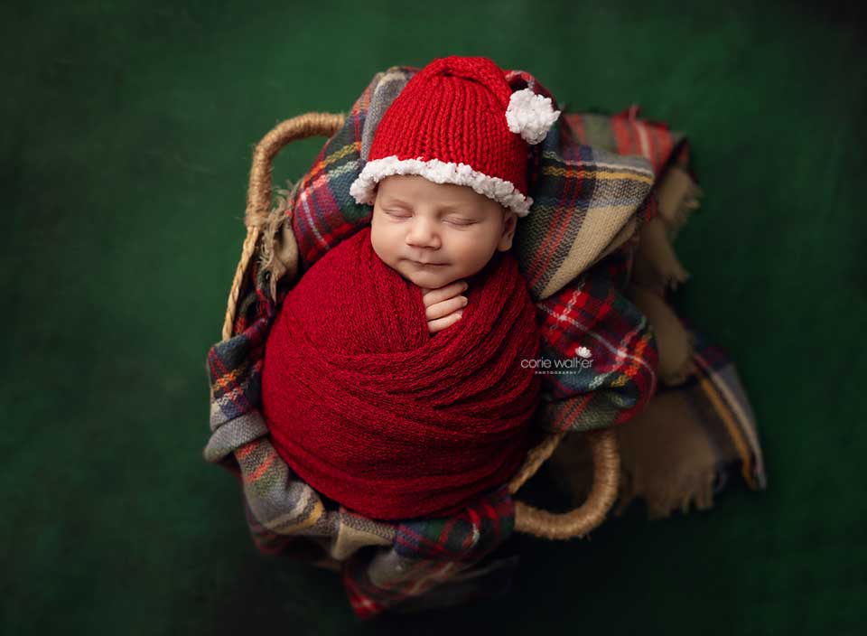 christmas themed photo of sleeping newborn baby
