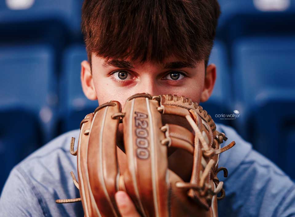 close up of senior boy with baseball mitt
